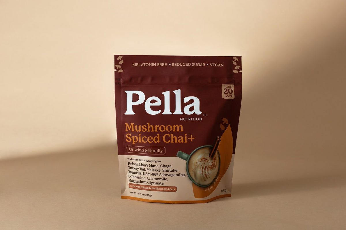 A bag of Pella Mushroom Spiced Chai with a chai latte