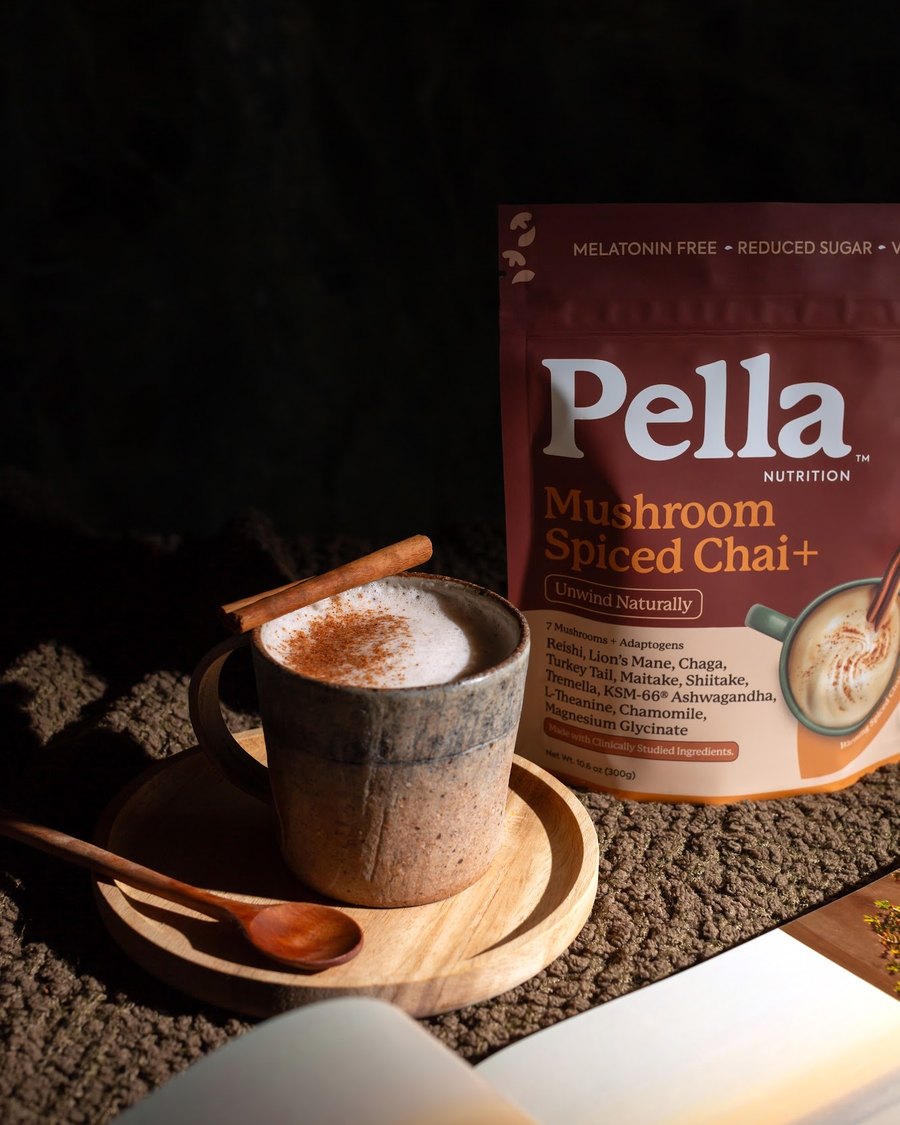 A mug of Pella Spiced Chai latte in the evening