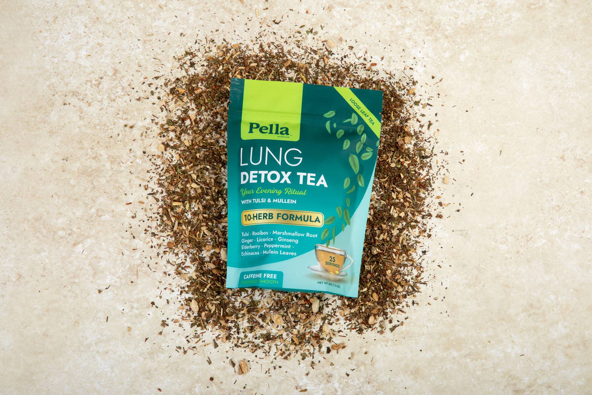Lung Detox Tea pouch on a bed of its loose-leaf herbs