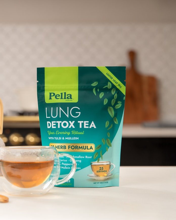 Lung Detox tea pouch with a cup of brewed tea