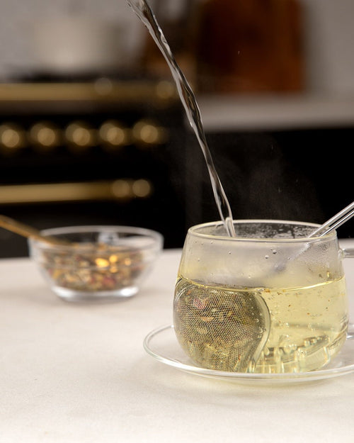 Pouring a cup of Liver Cleanse herbal tea