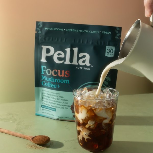 Milk poured into an iced Pella Focus coffee